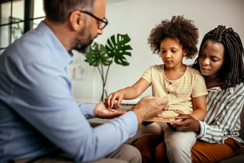 child playing with doctor