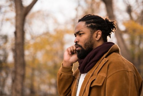 Man talking on cellphone while outdoors