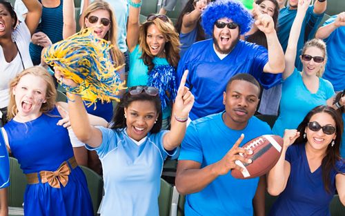 group of people cheering