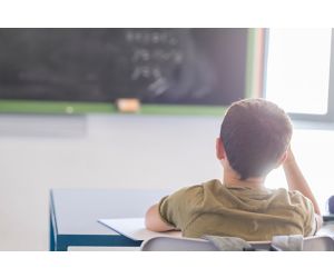 Child sitting at a desk