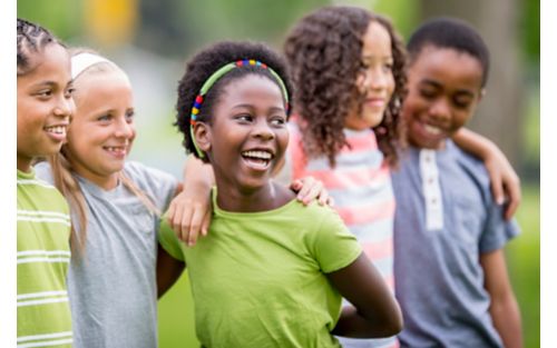 photo of group of children laughing