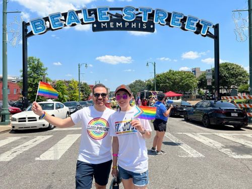Photo of 2 people in St. Jude shirts at Pride event