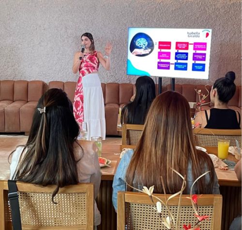 Isabella giving a presentation to group of people