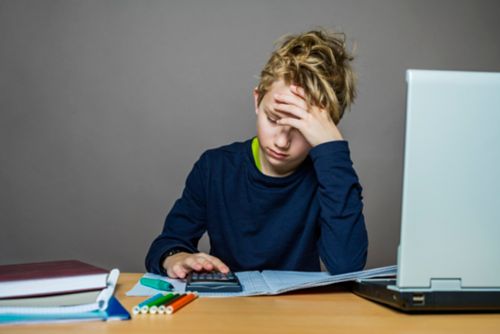 Boy looking frustrated while studying
