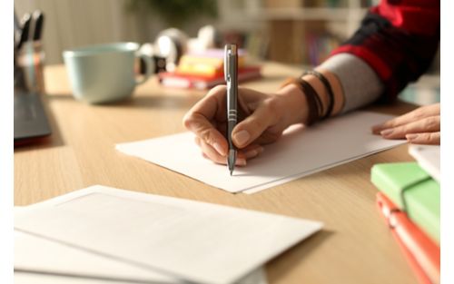 Woman writing in notebook