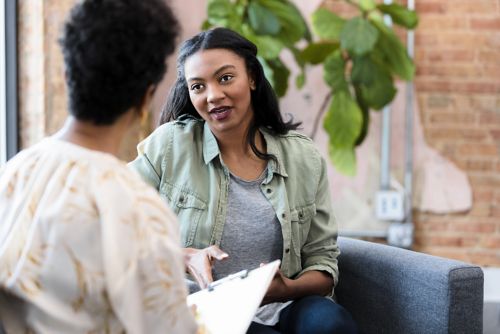 Two women speaking