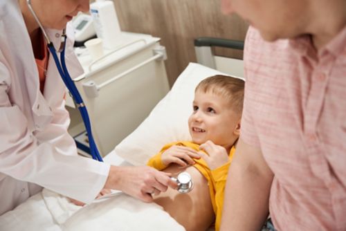 Male child checked out by doctor 