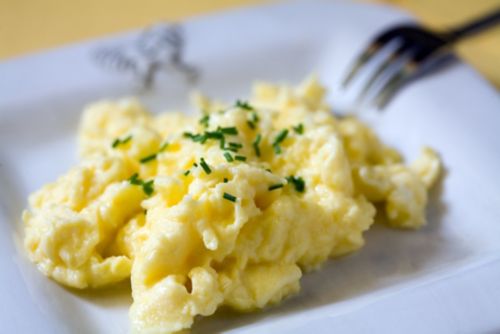Closeup of fluffy, scrambled eggs.