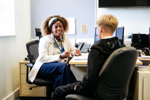 School principal talking with student