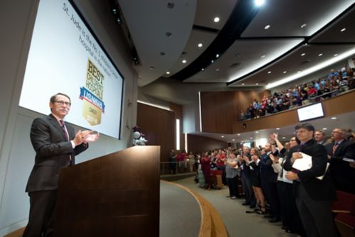 Photo of Dr. James R. Downing speaking to employees