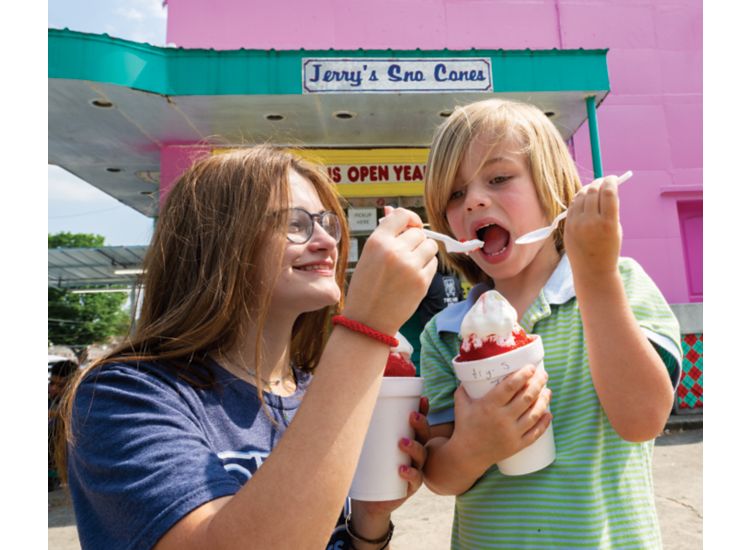 Photo of woman and child eating snocones