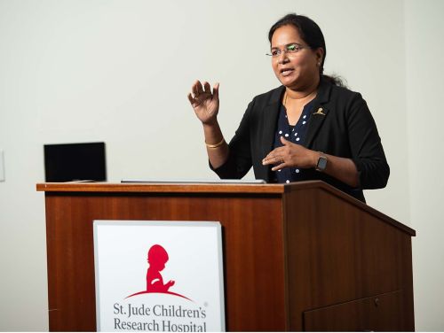 Thirumala-Devi Kanneganti speaking at podium
