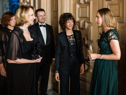 Elaine Tuomanen and other women at a reception