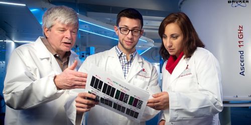 Photo of Richard Kriwacki (left) and researchers from his lab