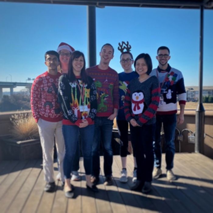 Kriwacki lab members wearing Christmas sweaters 