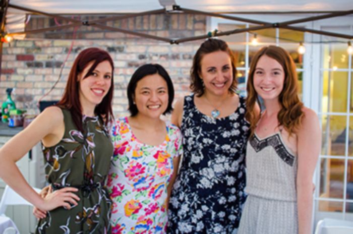 Female lab members pose together at backyard lab party