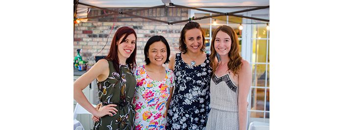 Female lab members pose together at backyard lab party