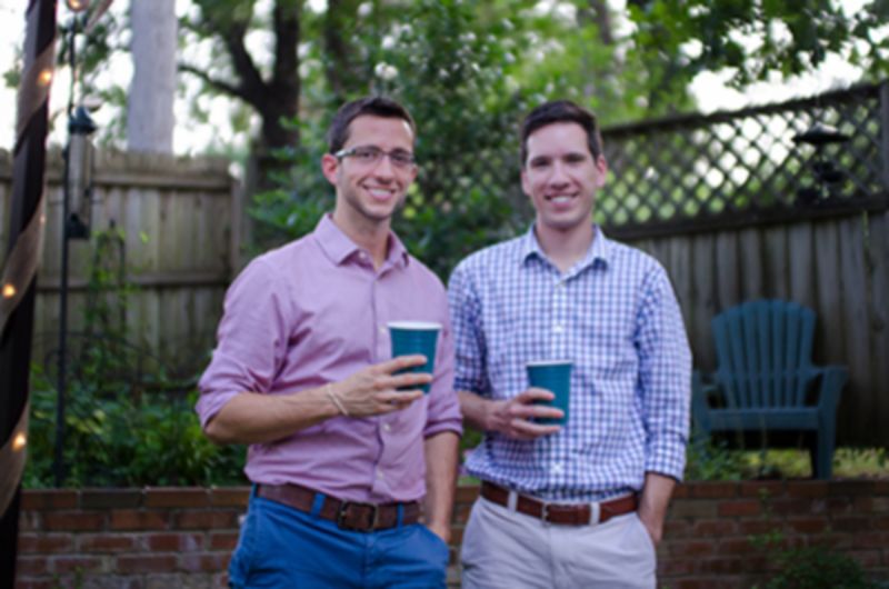 Two male lab members at backyard lab party