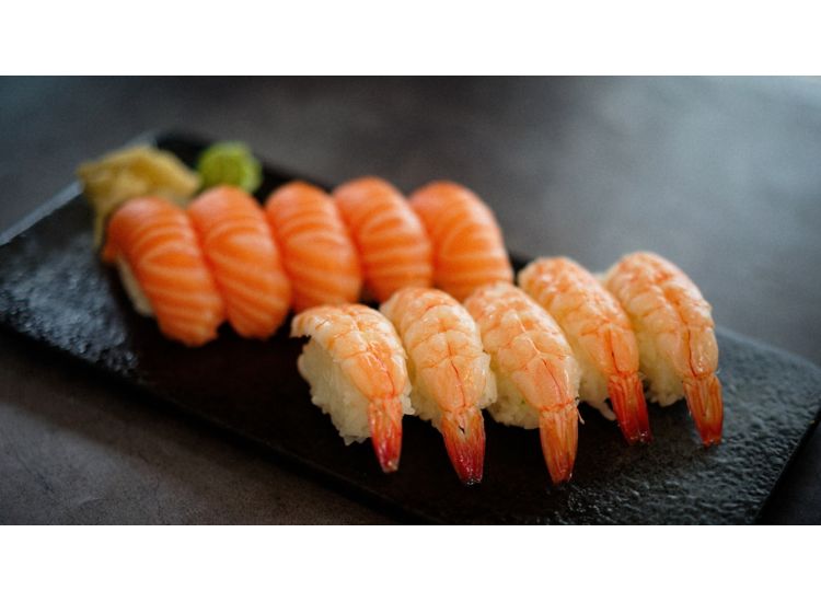 Close up of sashimi sushi with shrimp and salmon.