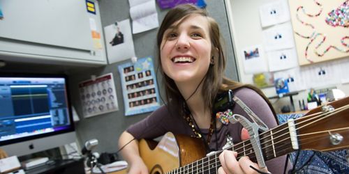 Woman playing guitar