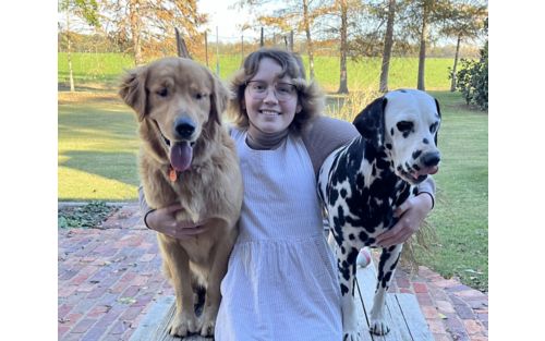 Maddy with two of her dogs