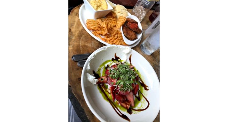 Two plated dishes at Magnolia and May Restaurant in Memphis.