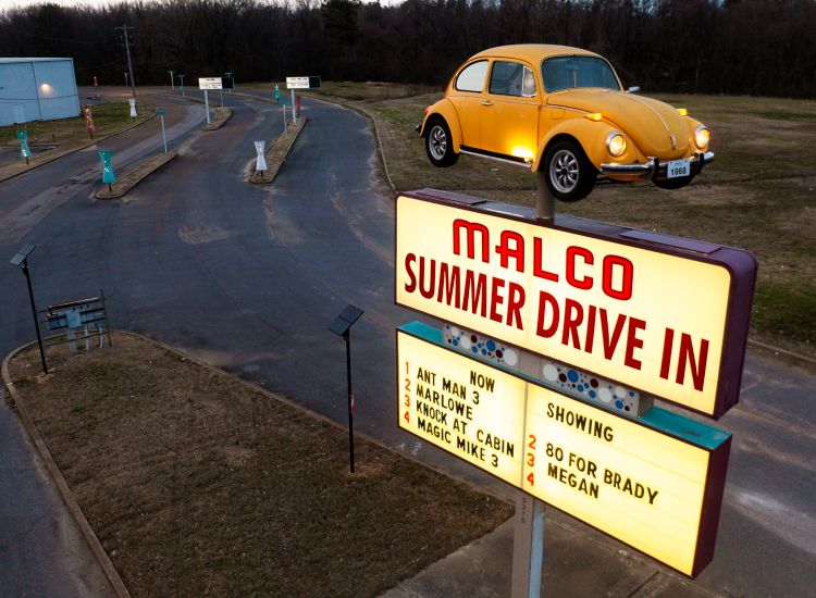 image of drive-in sign with VW on top of pole