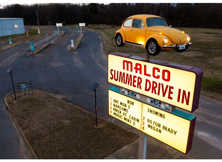 image of drive-in sign with VW on top of pole