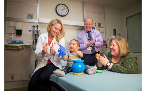 Image of doctors, patient and parent