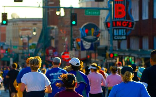 People running in a marathon on Beale Street