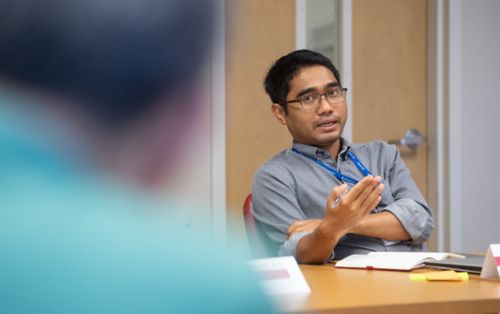 Male graduate student in classroom