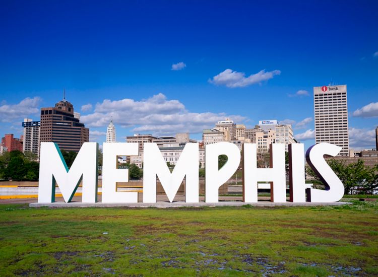 Memphis sign with sky scrapers in the background at Mud Island River Park.