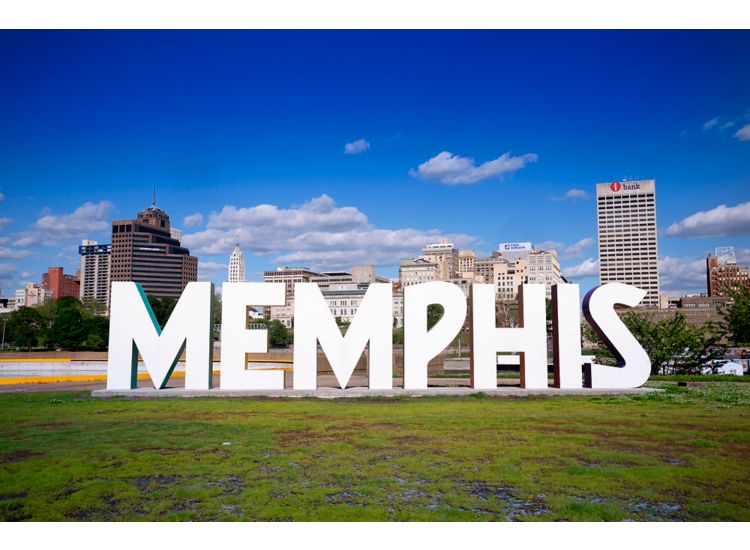 Memphis sign with sky scrapers in the background at Mud Island River Park.