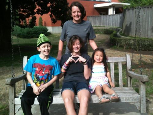 Micah pictured with his brother and two sisters.