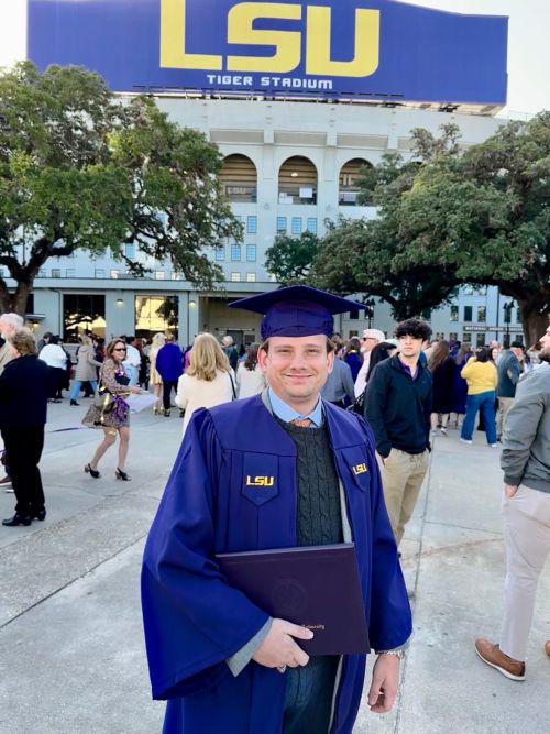 Micahel in his graduation gown at LSU. 