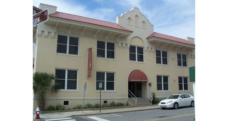 Exterior of Pensacola Museum of Art, white building with red accents