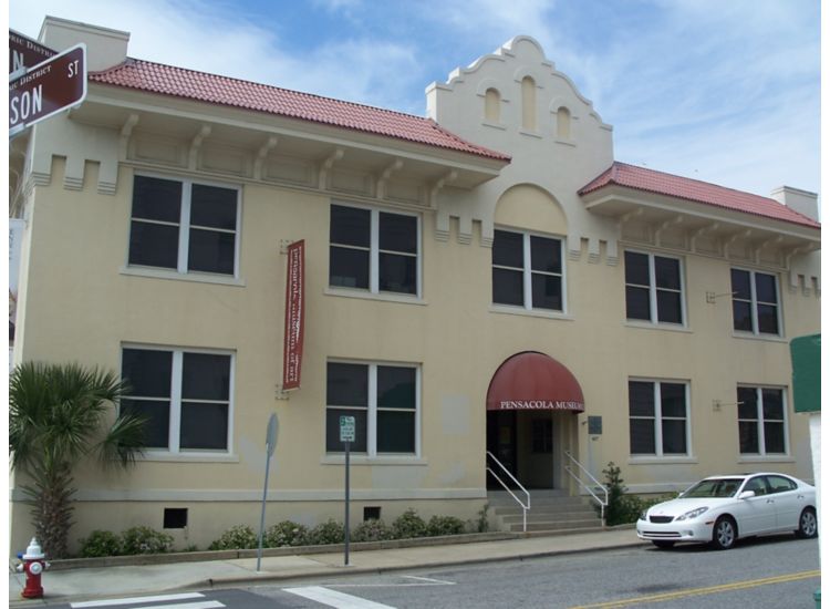 Exterior of Pensacola Museum of Art, white building with red accents