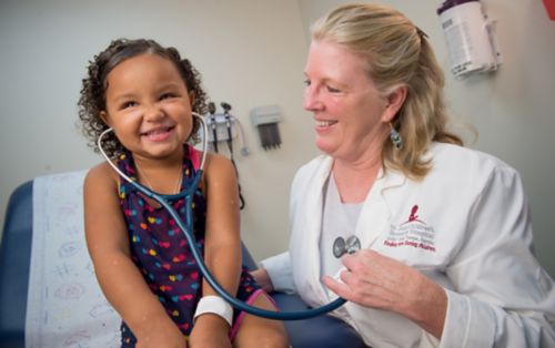 Kim Nichols, MD, and young St. Jude patient