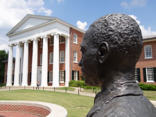 image of sculpture of James Meredith with building in background
