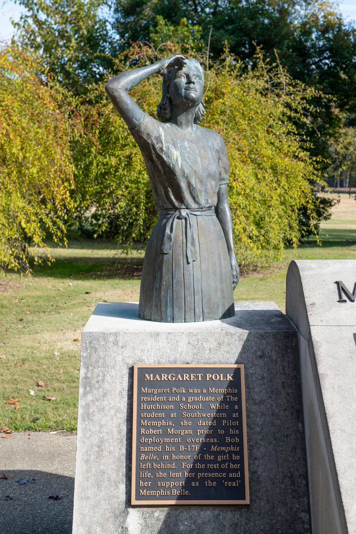 Statue of a woman looking towards the sky, labeled Margaret Polk.