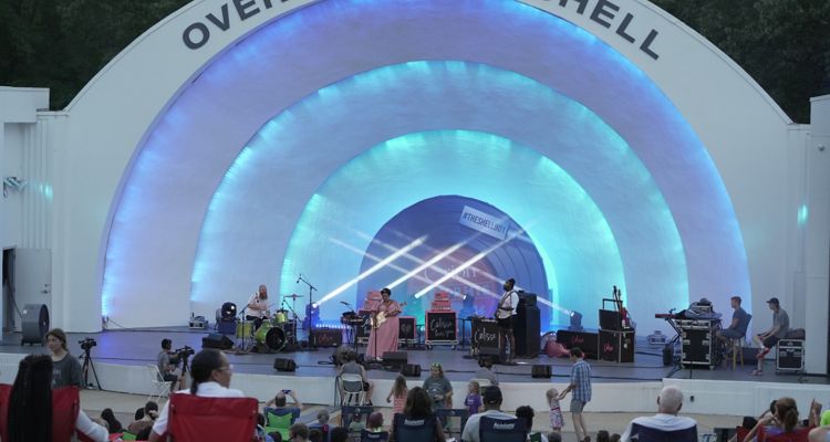 Musicians perform while spectators watch at the Overton Park Band Shell in Memphis.