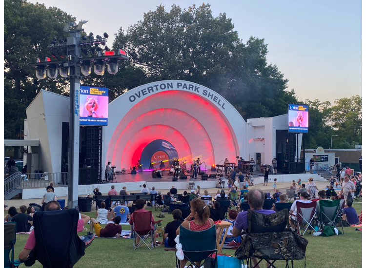 Musicians perform while spectators watch at the Overton Park Band Shell in Memphis.