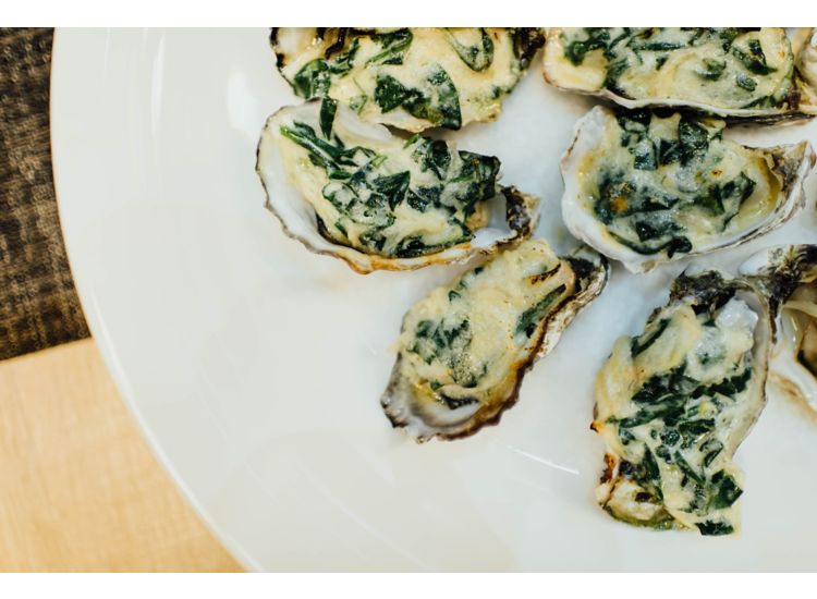 Closeup of oysters on a plate.