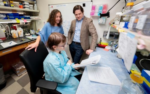 Three people working in lab