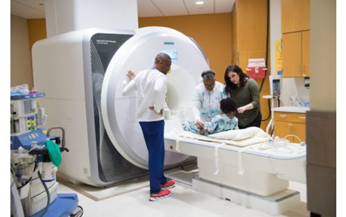 Patient Aaliyah goes through MRI scanner