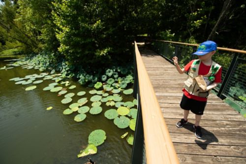 Many camps and retreat centers for children with cancer have doctors and nurses on staff. In this photo, a young cancer patient enjoys a sunny day outside.
