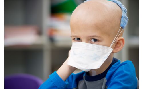 Young cancer patient wearing a mask 