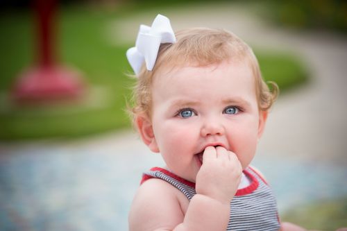 As part of normal social development, your child may plays games such as “peek-a-boo” and “pat-a-cake.”