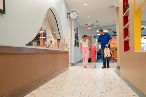 Family walks through Family Commons area at St. Jude