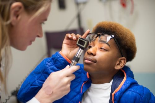 image of patient Isaiah getting examined